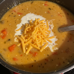 Cheese melting into creamy Hamburger Potato Soup