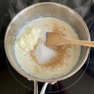 Heating milk, cream, and sugar for banana pudding ice cream base.