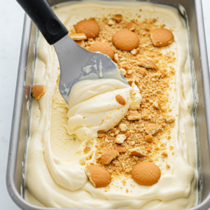 Banana pudding ice cream in a container, ready to freeze.